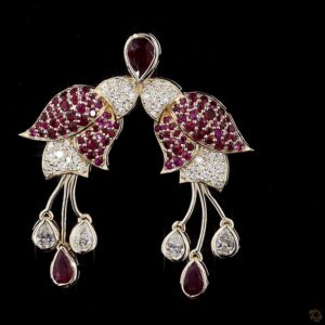 Dangling gold earrings with ruby drops and diamonds