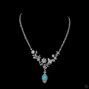 Elegant floral statement necklace with blue teardrop